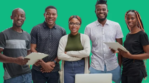 shooting-gallery-darkskinned-businessmen-sit-office-pose-camera copy shooting-gallery-darkskinned-businessmen-sit-office-pose-camera copy